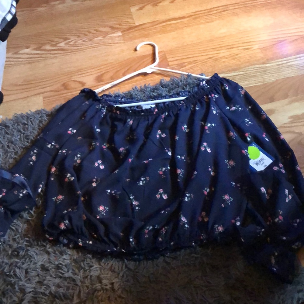 Navy blue floral bell top.